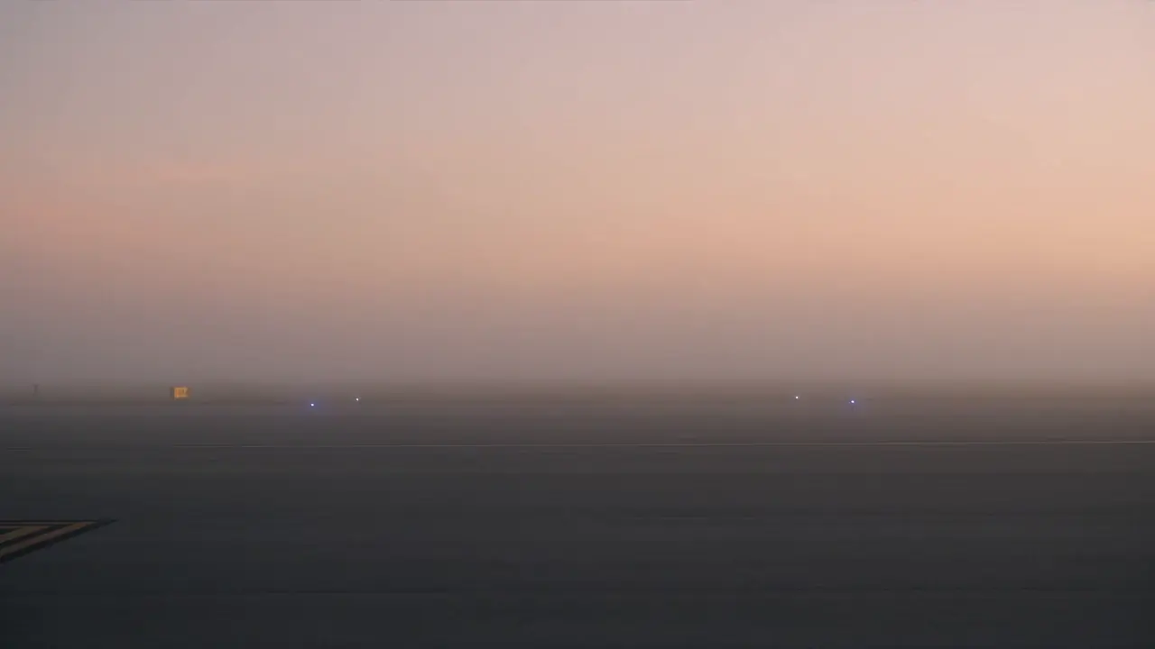 Grey SUV on an empty road at dawn